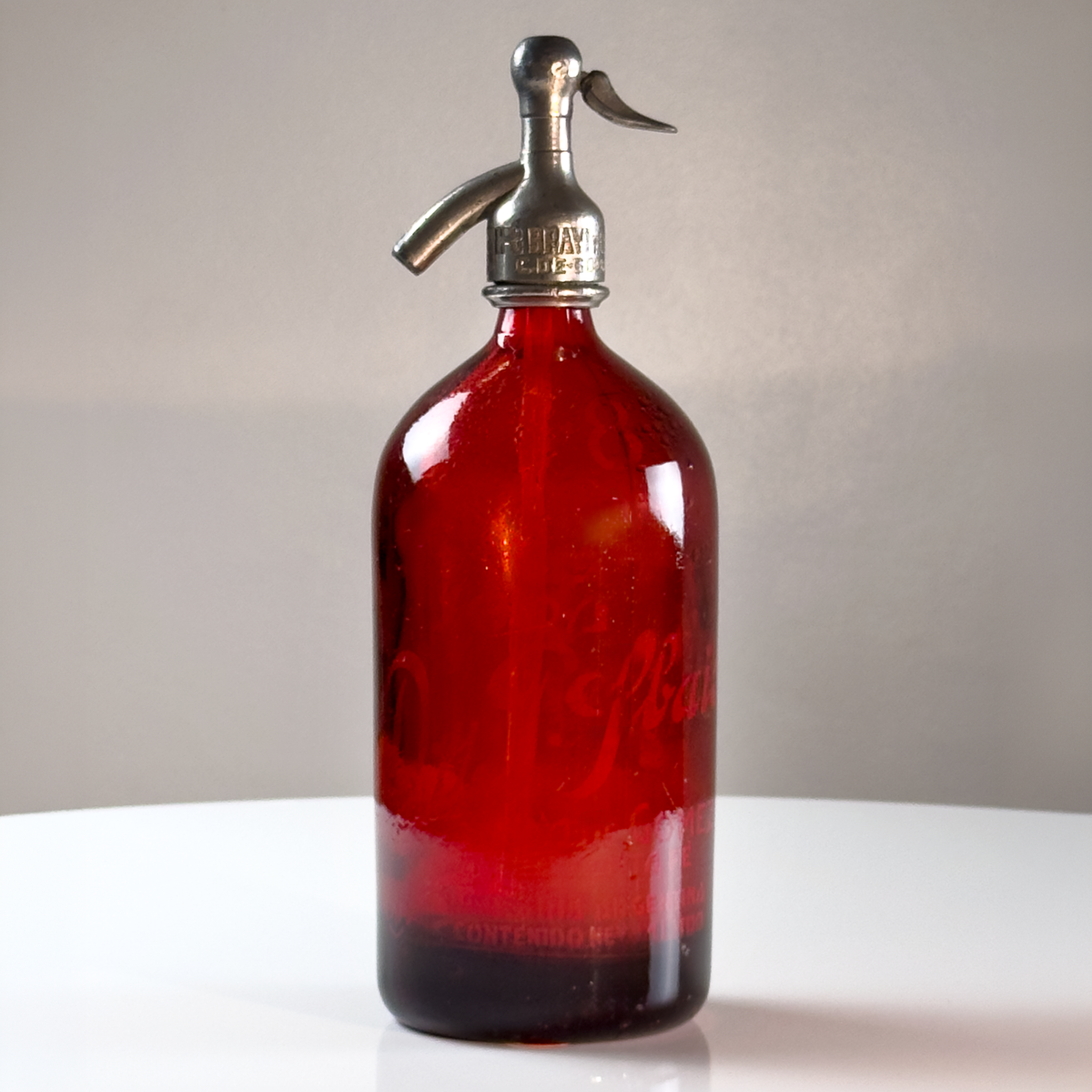 1 liter Red Lithographed Vintage Seltzer Bottle.